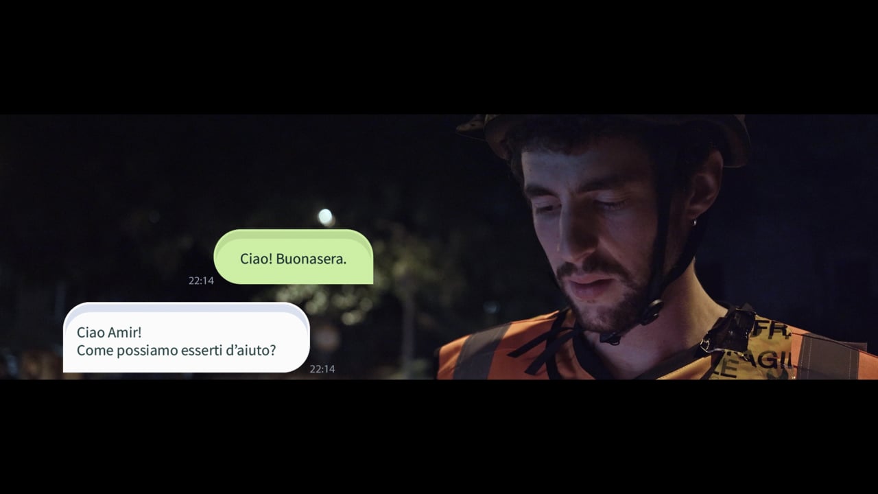 Film still from the fà-me trailer showing a courier inside a car at night